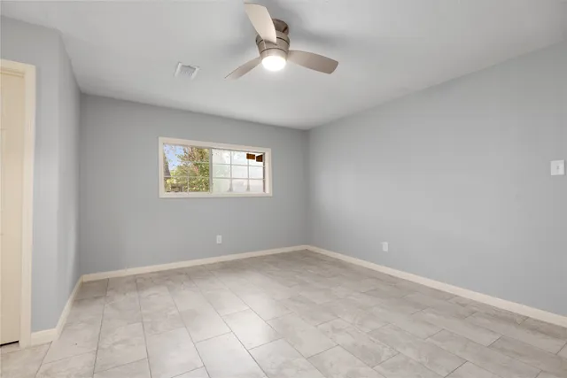 wooden floor in an empty room with a cabinet