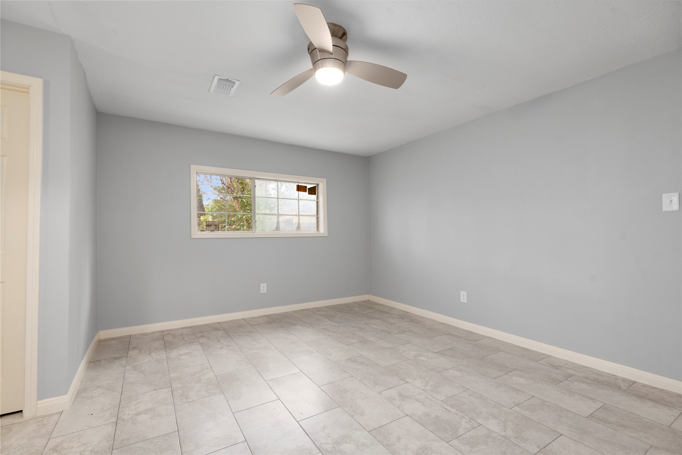4919 Tealgate Drive Spring, TX 77373 - Photo 23 of 38 a view of an empty room with a window