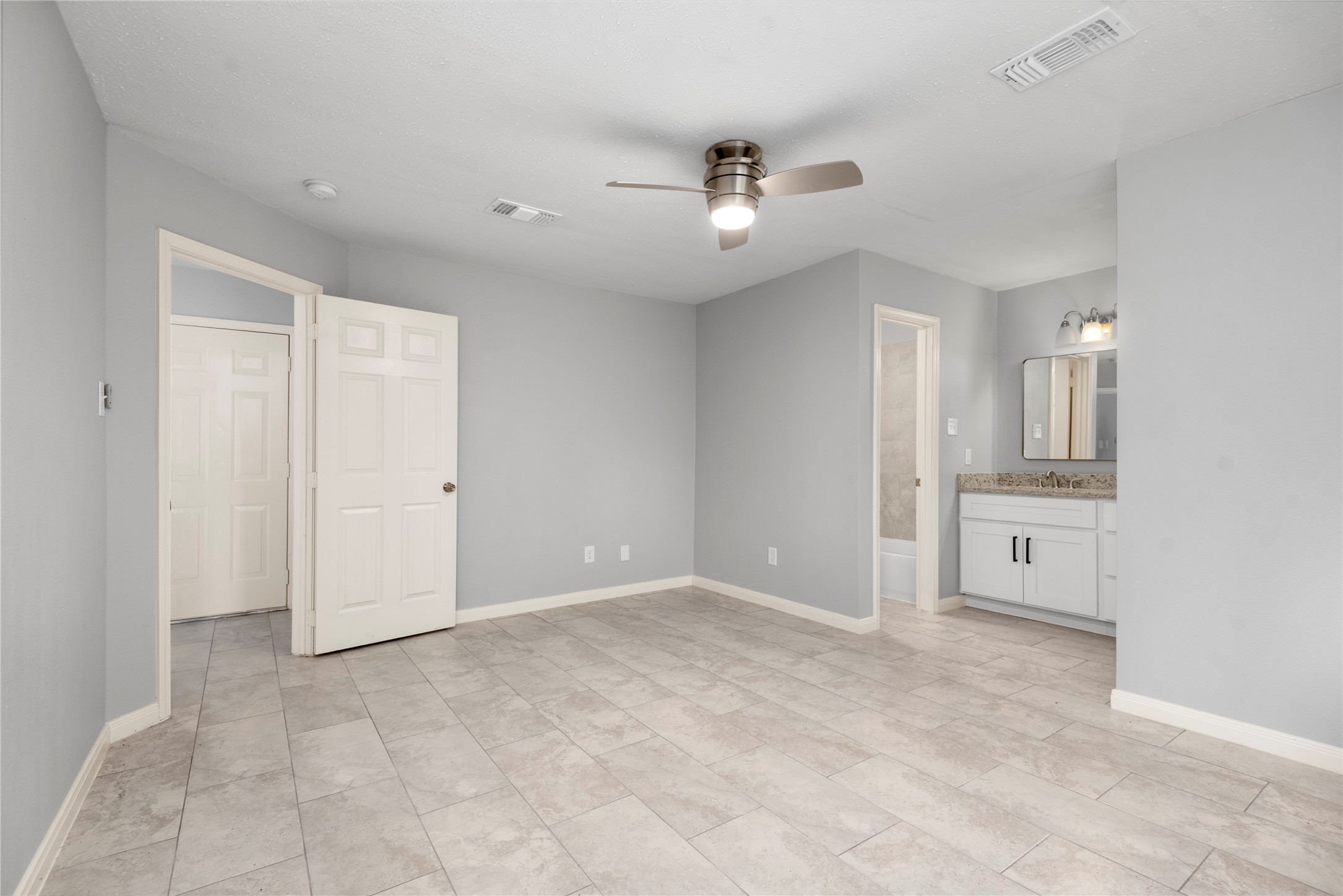 4919 Tealgate Drive Spring, TX 77373 - Photo 24 of 38 wooden floor in an empty room with a cabinet