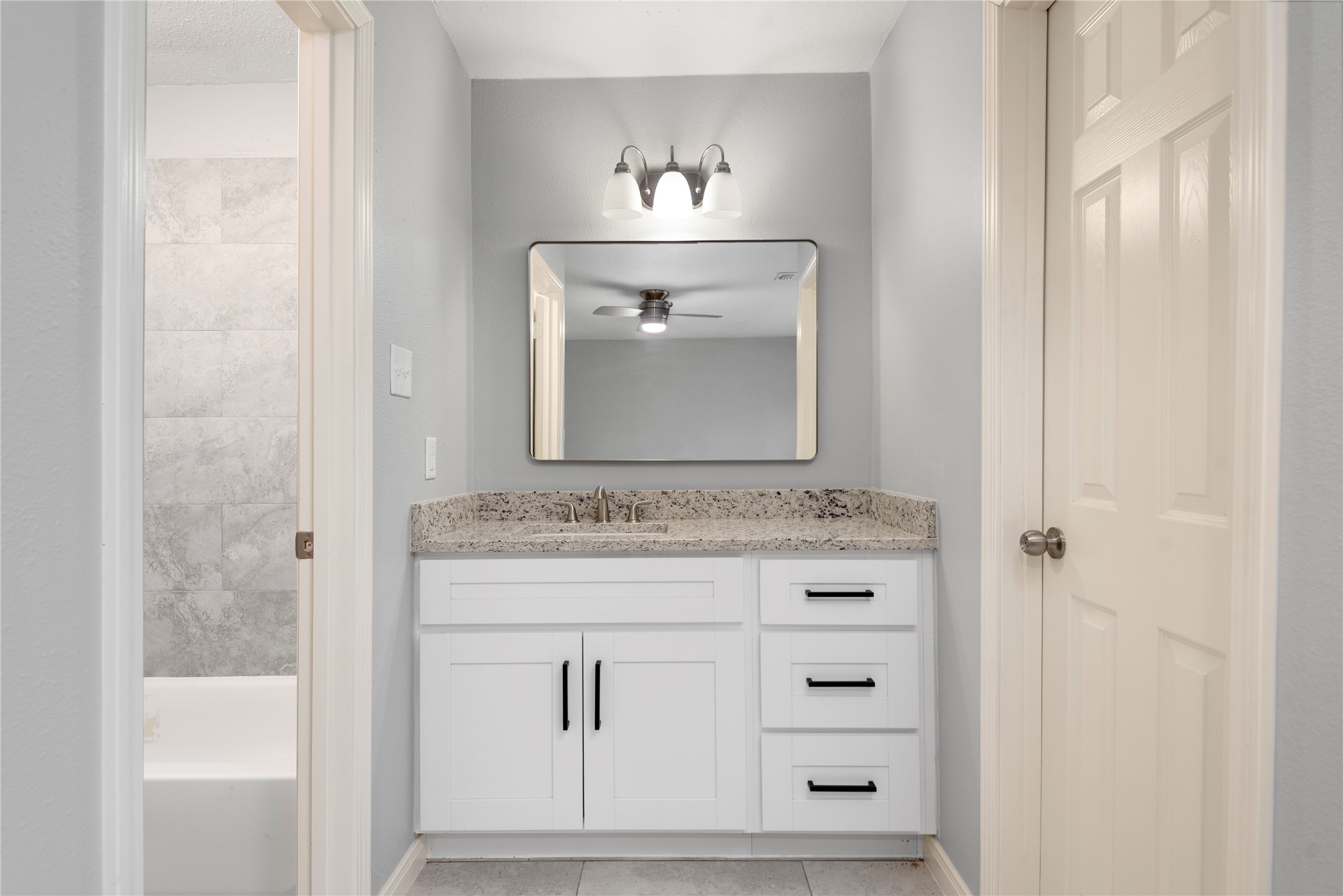 4919 Tealgate Drive Spring, TX 77373 - Photo 26 of 38 a bathroom with a mirror sink and vanity