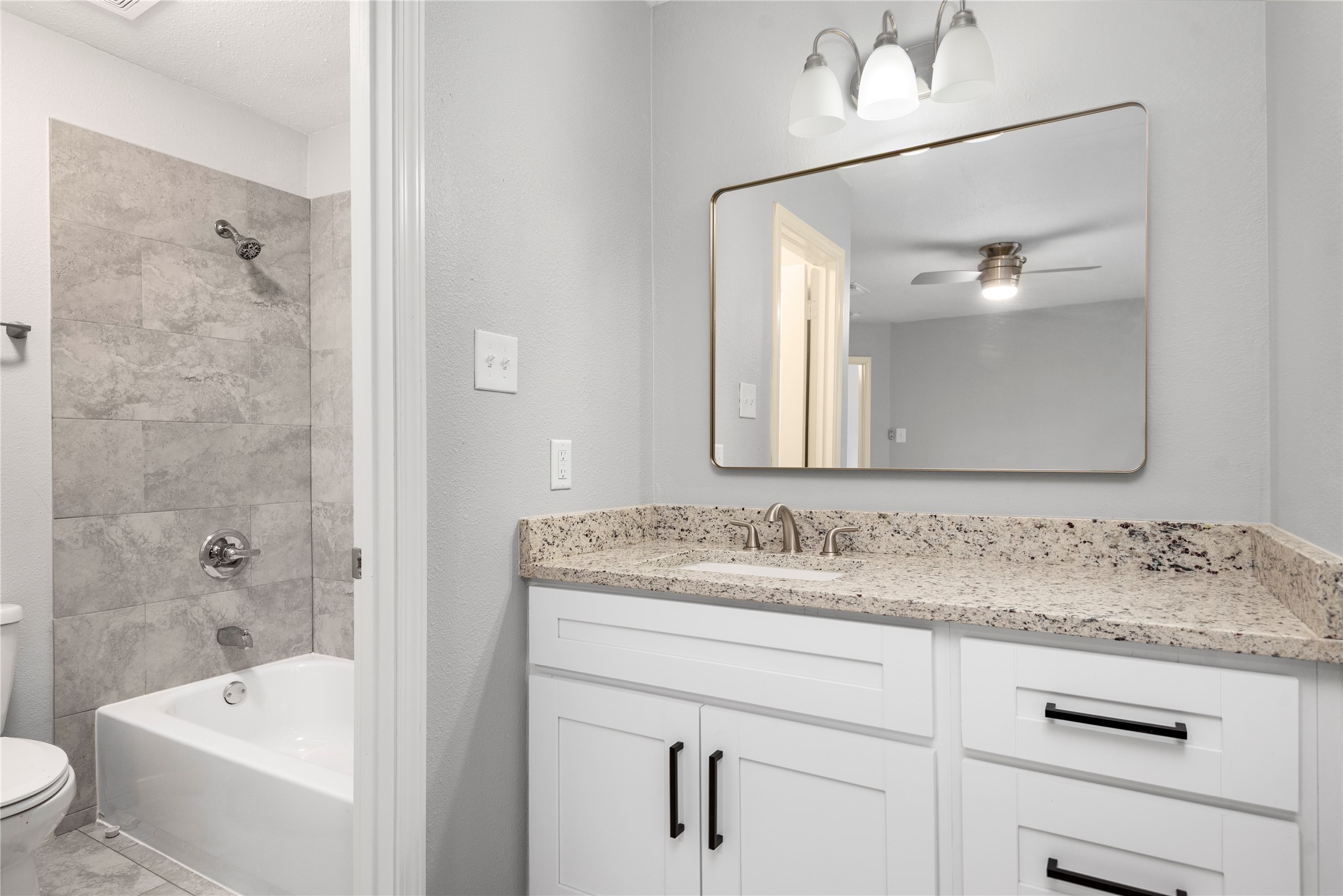 4919 Tealgate Drive Spring, TX 77373 - Photo 27 of 38 a bathroom with a tub sink and mirror