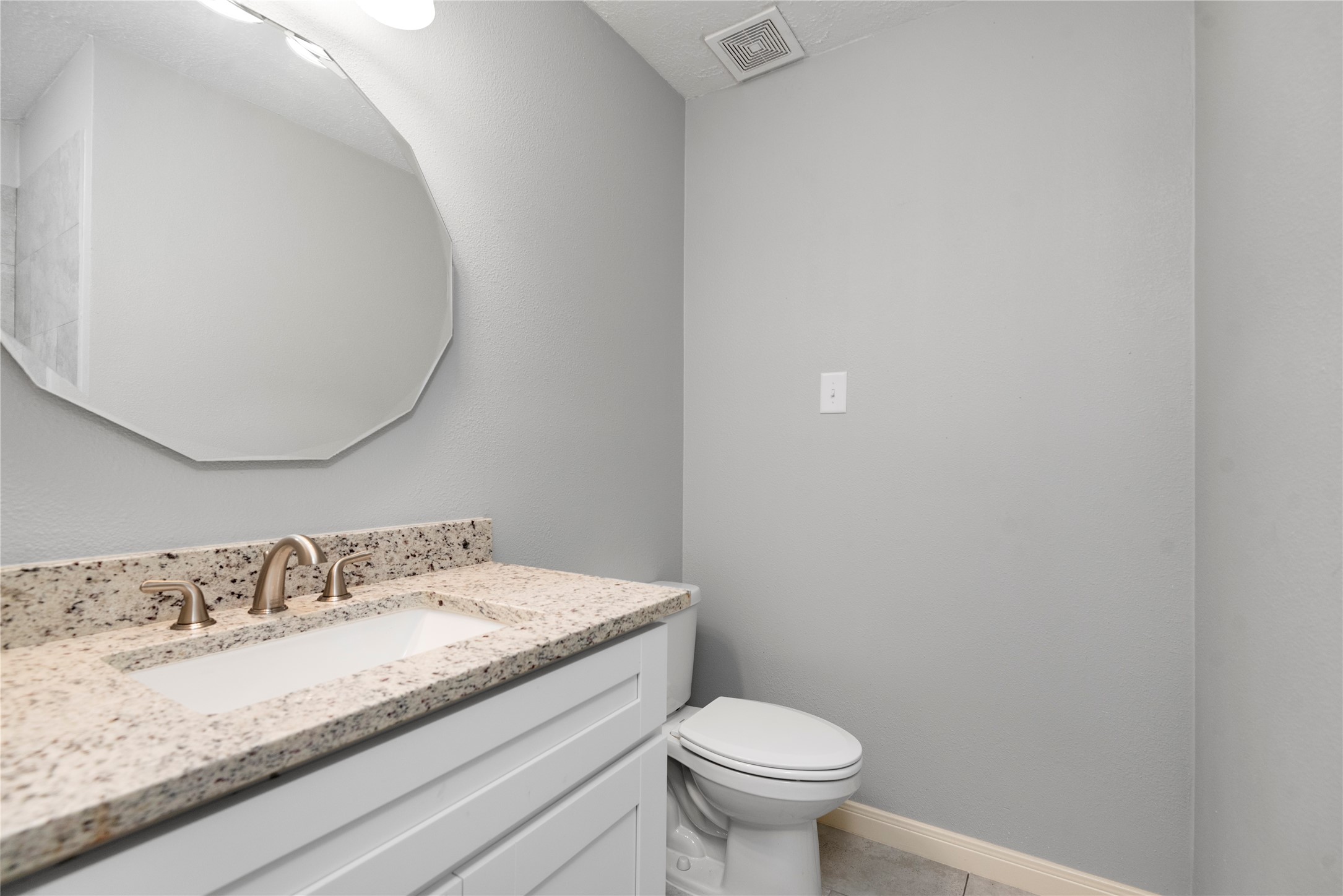 4919 Tealgate Drive Spring, TX 77373 - Photo 33 of 38 a bathroom with a granite countertop sink and a mirror