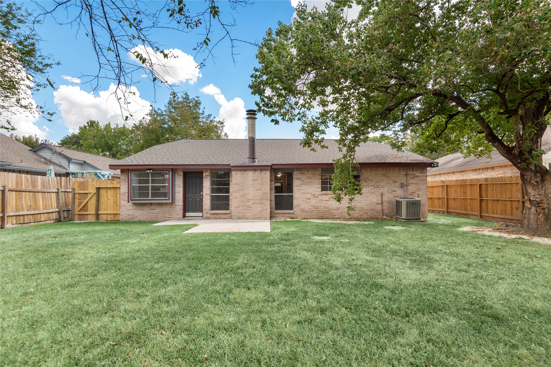 4919 Tealgate Drive Spring, TX 77373 - Photo 35 of 38 a front view of a house with a yard and trees