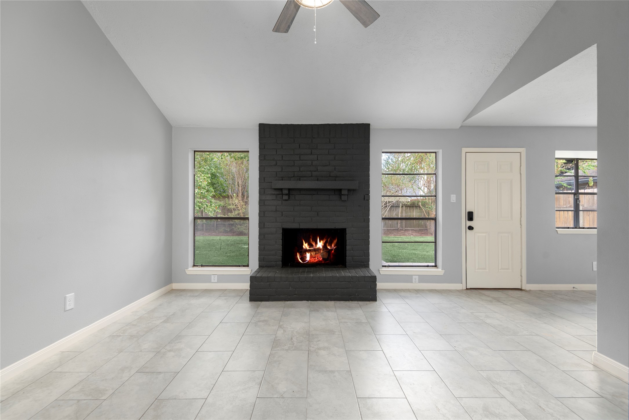 4919 Tealgate Drive Spring, TX 77373 - Photo 10 of 38 a view of an empty room with a fireplace and window
