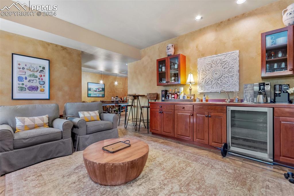 5090 South Perry Park Road Sedalia, CO 80135 - Photo 35 of 50 a living room with furniture and a potted plant
