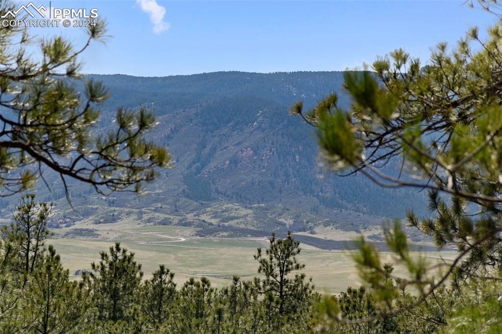 5090 South Perry Park Road Sedalia, CO 80135 - Photo 46 of 50 a view of a lake with a mountain in the background