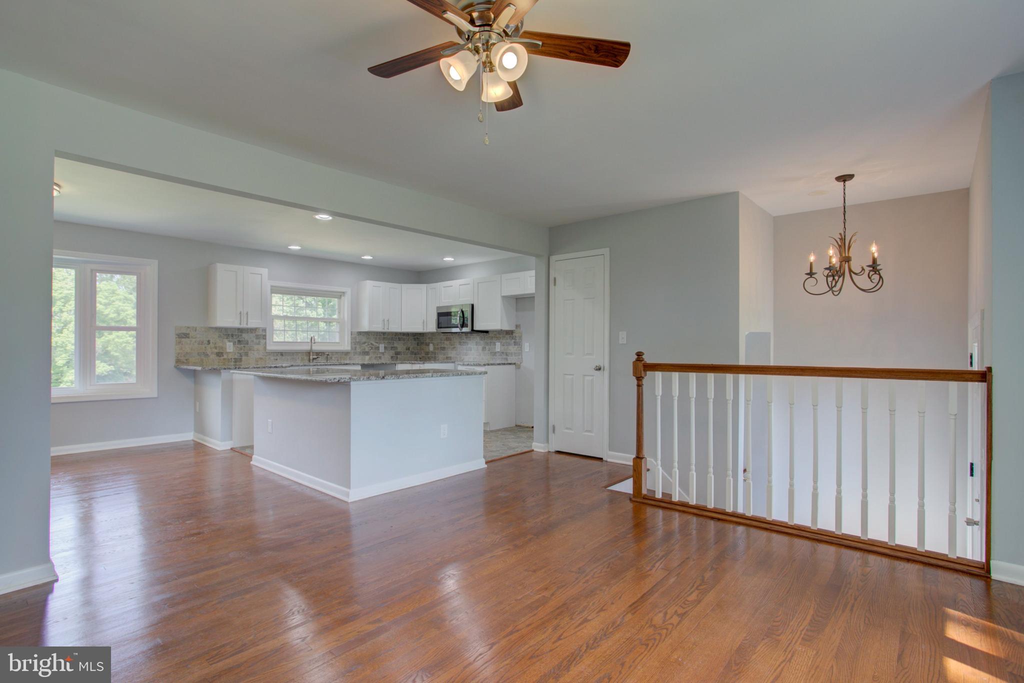 1229 Rawlinsville Road New Providence, PA 17560 - Photo 11 of 29 a view of a kitchen with a dishwasher cabinets and wooden floor