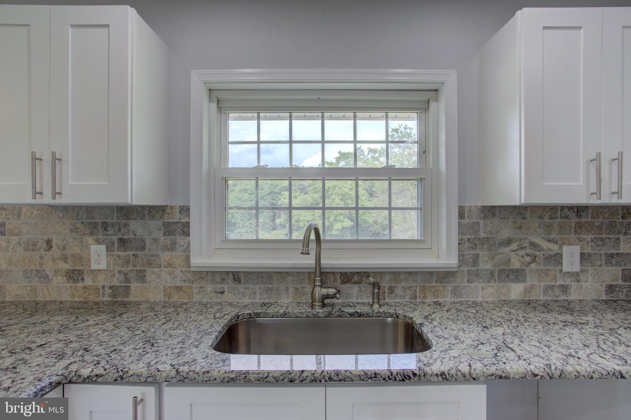 1229 Rawlinsville Road New Providence, PA 17560 - Photo 14 of 29 a kitchen with granite countertop a sink and a granite counter tops