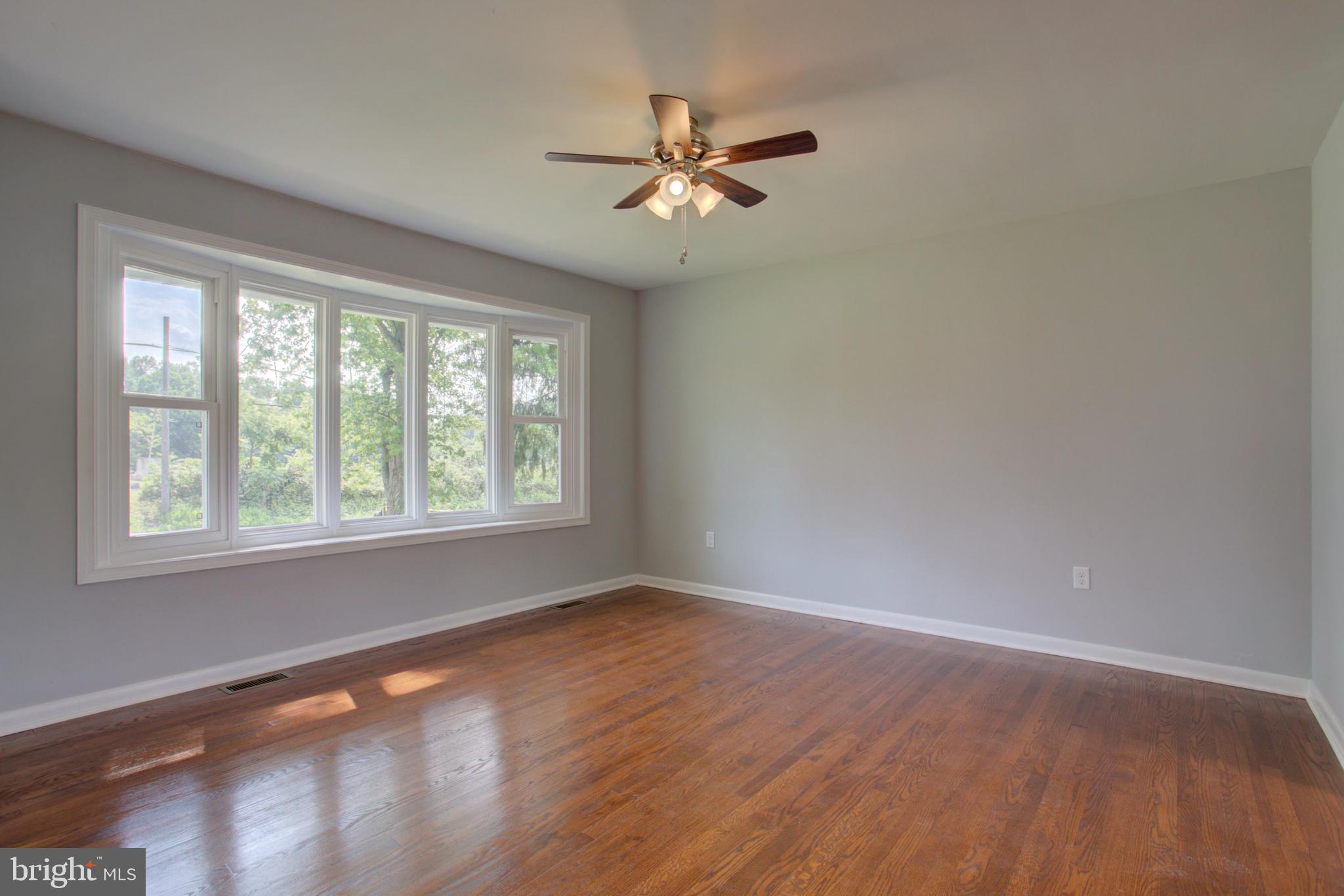 1229 Rawlinsville Road New Providence, PA 17560 - Photo 16 of 29 a view of an empty room with wooden floor and a window
