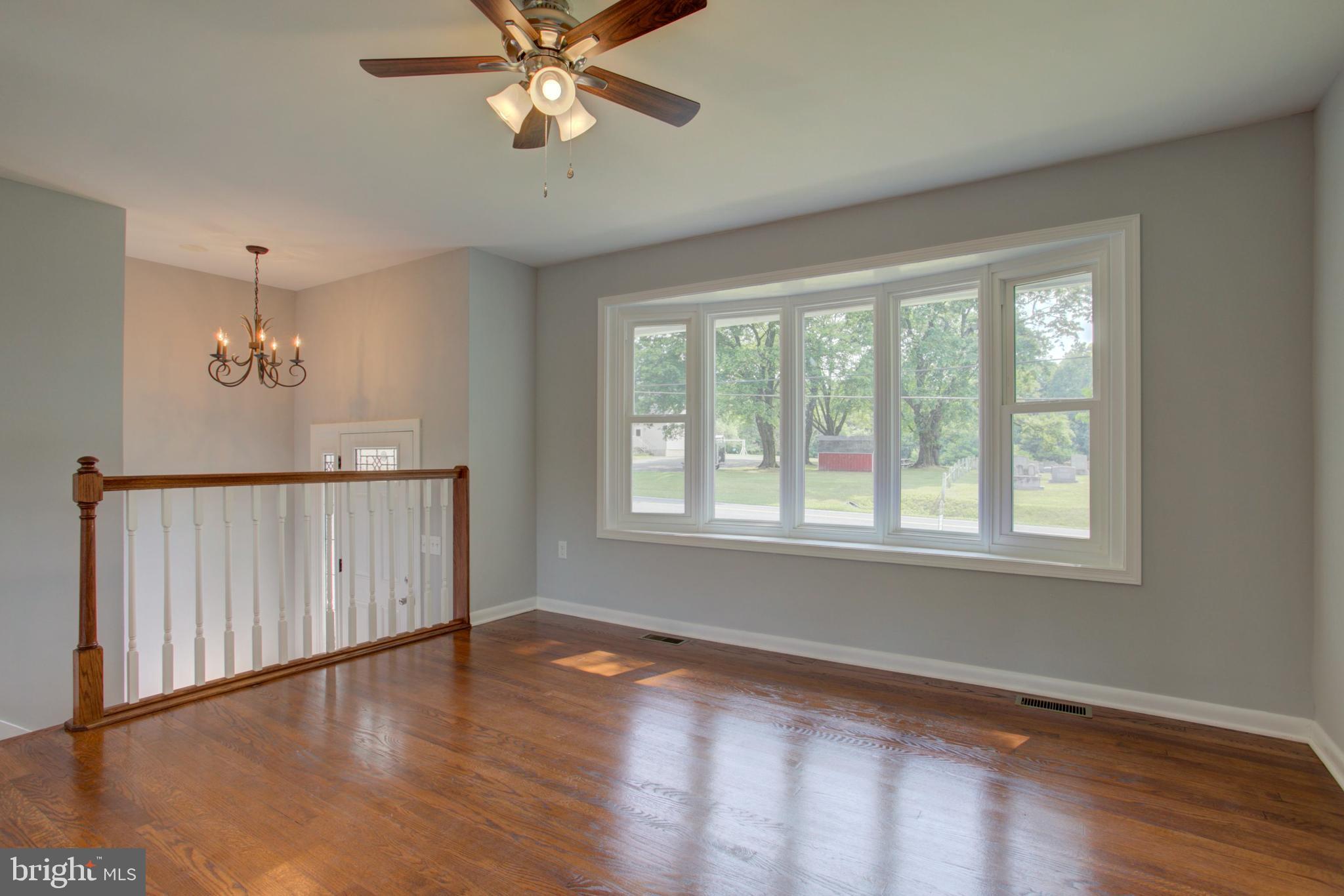 1229 Rawlinsville Road New Providence, PA 17560 - Photo 17 of 29 a view of an empty room with wooden floor and a window