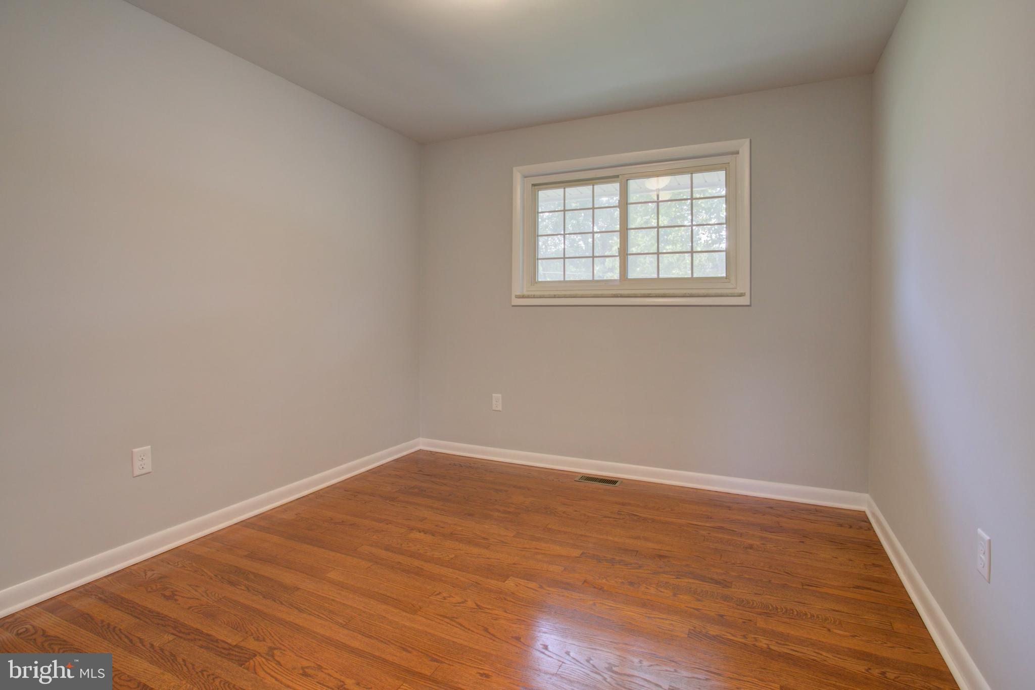 1229 Rawlinsville Road New Providence, PA 17560 - Photo 18 of 29 wooden floor in an empty room with a window