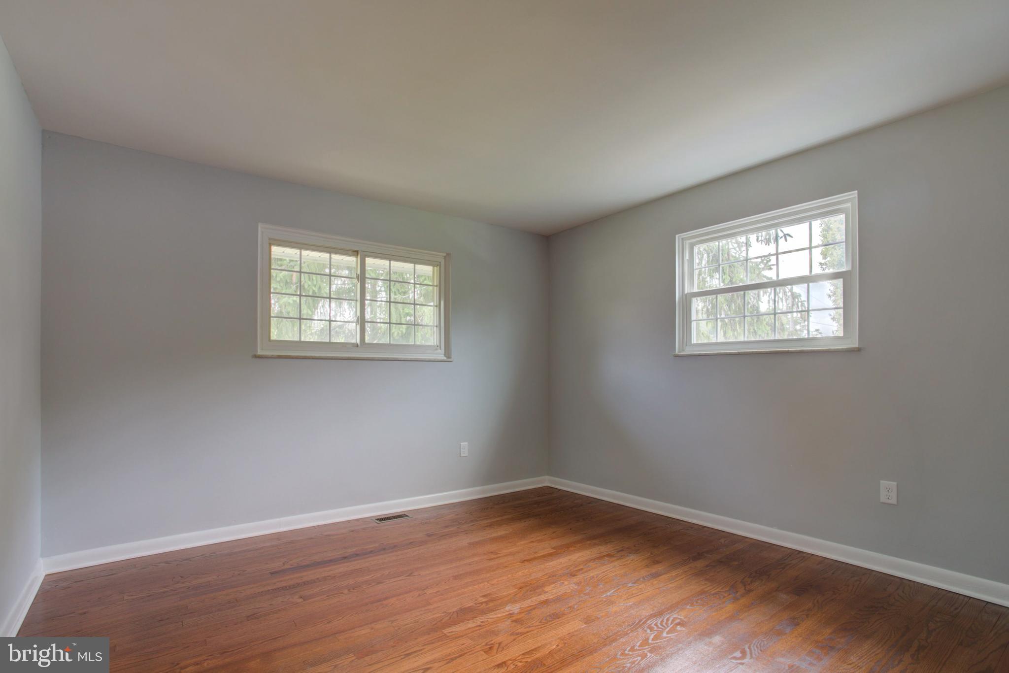 1229 Rawlinsville Road New Providence, PA 17560 - Photo 19 of 29 a view of an empty room with wooden floor and a window
