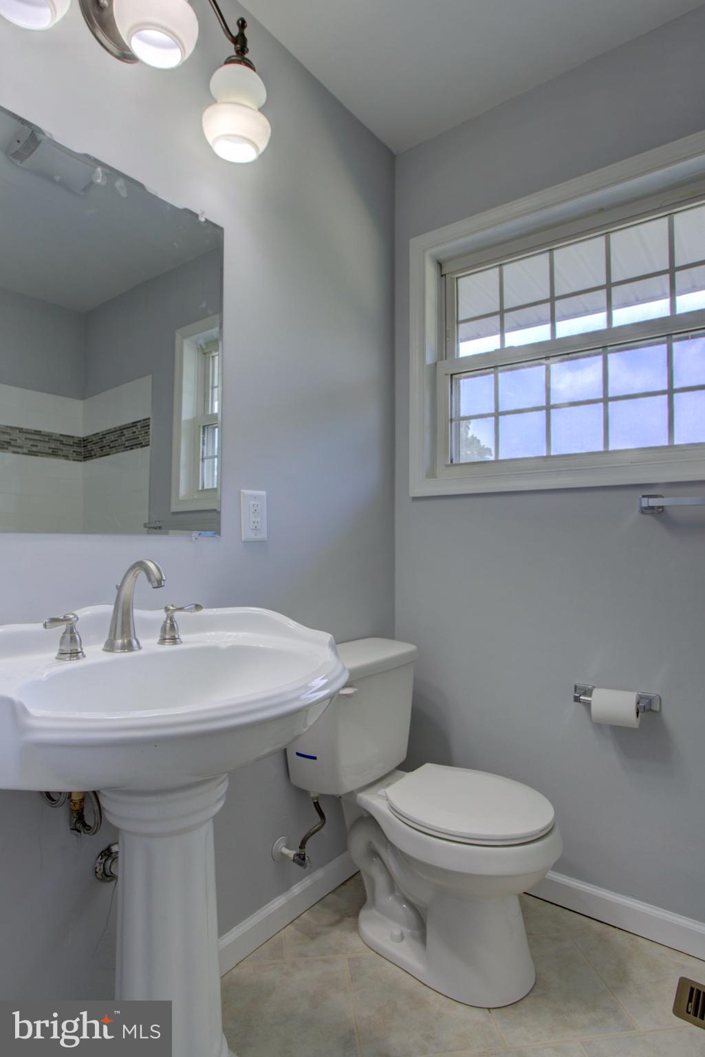 1229 Rawlinsville Road New Providence, PA 17560 - Photo 23 of 29 a white toilet sitting next to a bathroom sink