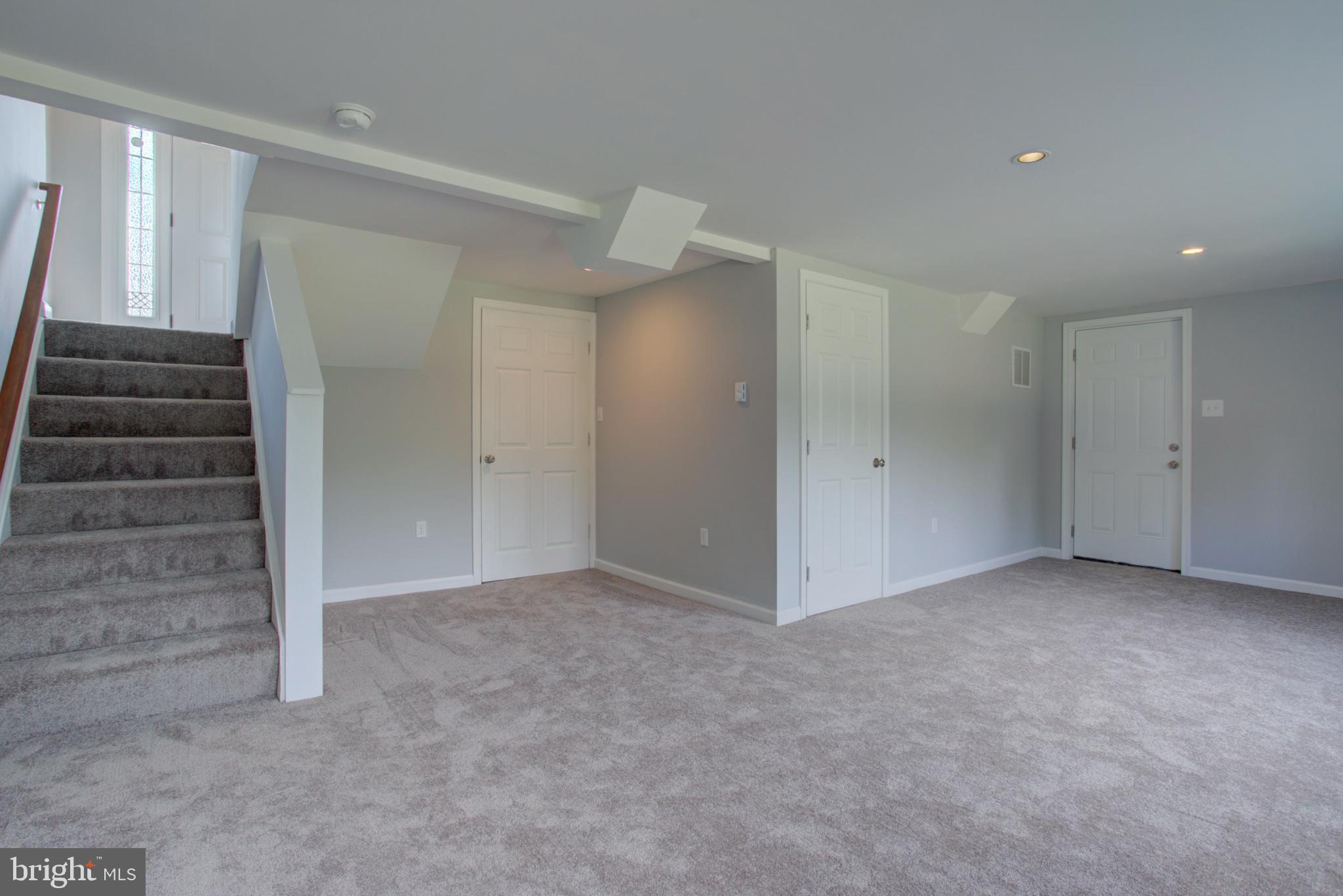 1229 Rawlinsville Road New Providence, PA 17560 - Photo 27 of 29 an empty room with a hallway and stairs