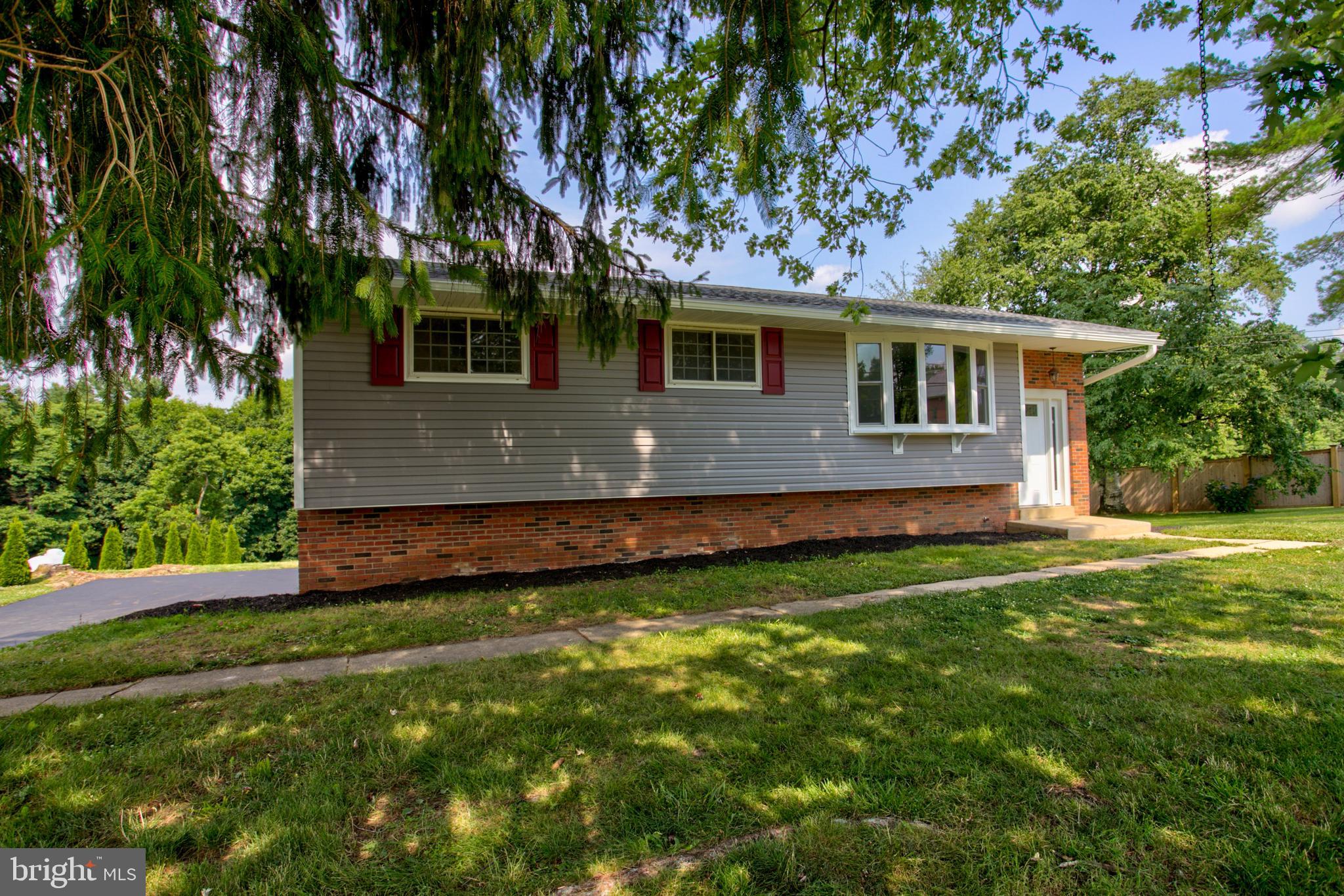 1229 Rawlinsville Road New Providence, PA 17560 - Photo 4 of 29 a front view of a house with a yard