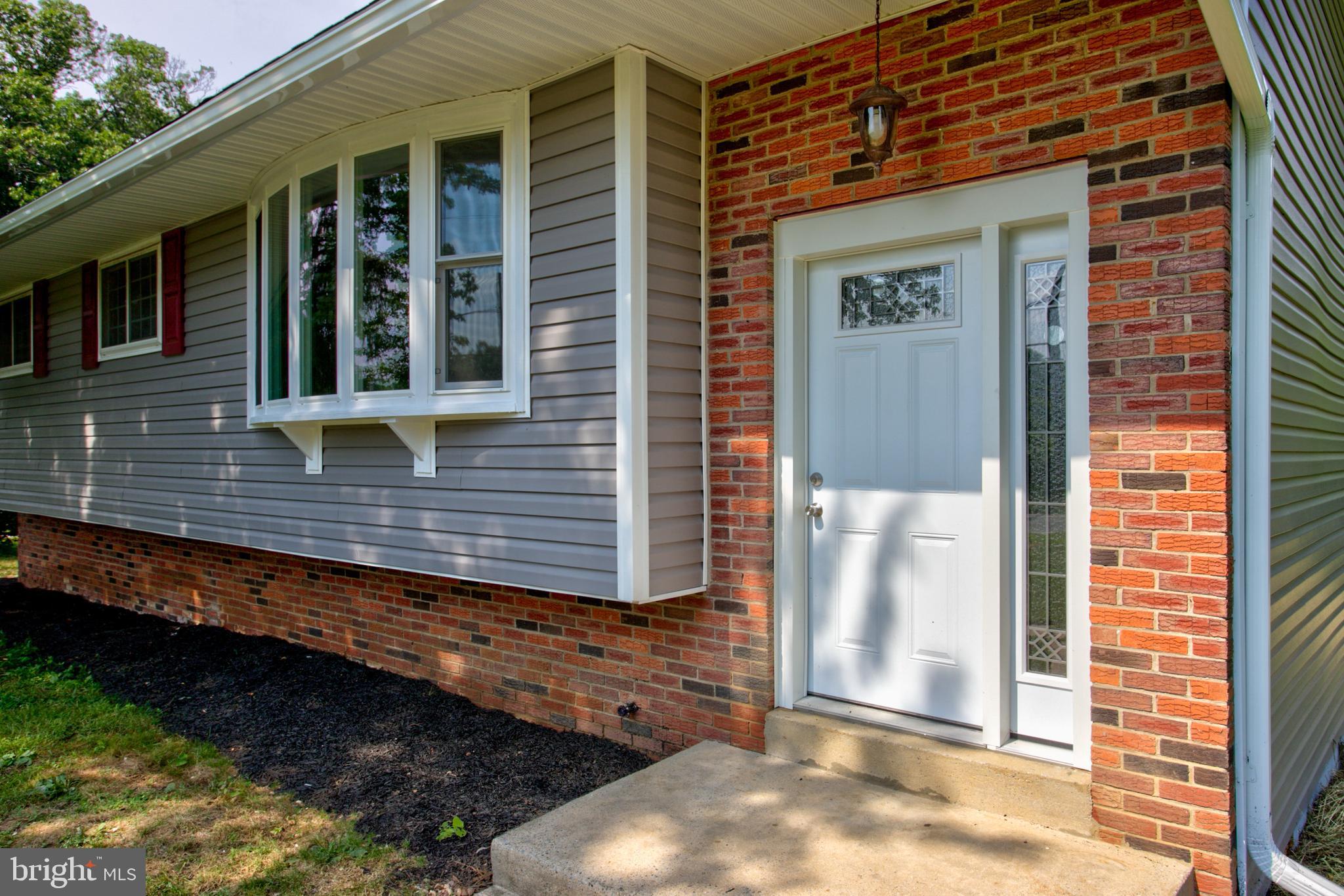 1229 Rawlinsville Road New Providence, PA 17560 - Photo 6 of 29 a view of brick house with a large window