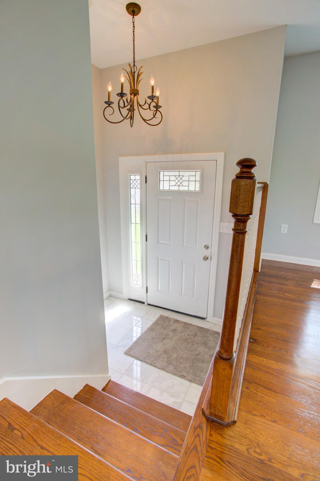 1229 Rawlinsville Road New Providence, PA 17560 - Photo 10 of 29 a view of a hallway with entryway wooden floor and front door
