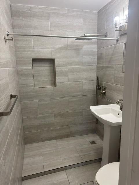 1709 North J Street Lake Worth Beach, FL 33460 - Photo 9 of 10 a bathroom with a sink a toilet and shower