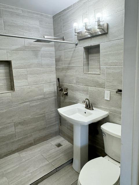 1709 North J Street Lake Worth Beach, FL 33460 - Photo 10 of 10 a bathroom with a sink toilet and shower