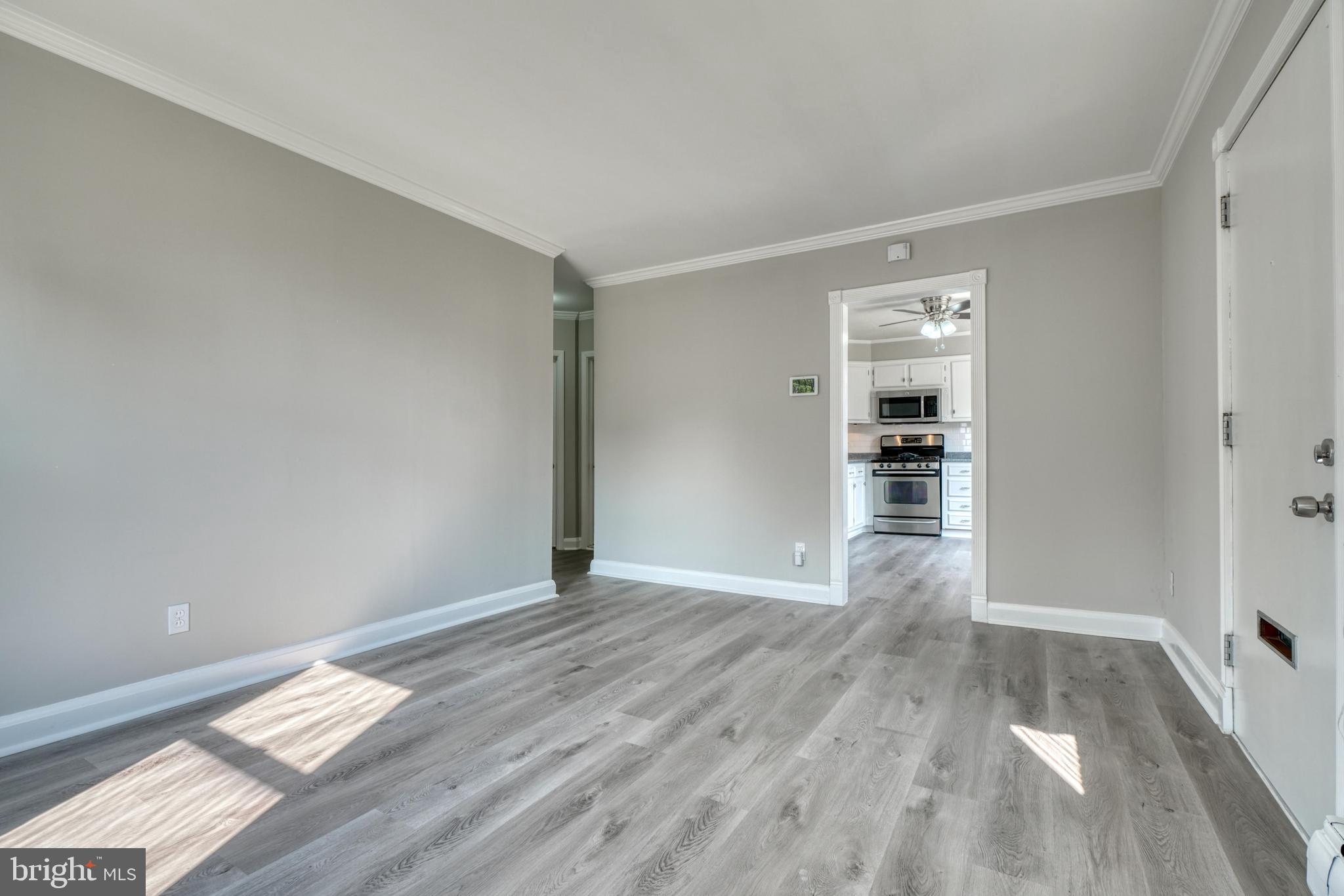 914 Lance Avenue Baltimore, MD 21221 - Photo 5 of 38 Living Room / Kitchen Entrance View