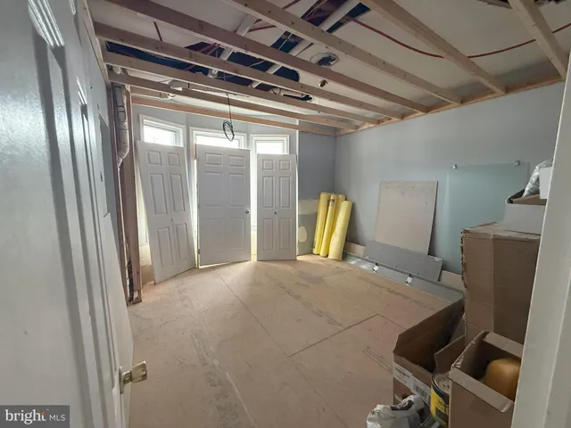 a view of an empty room with a fireplace