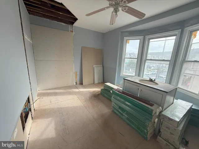 a view of a porch with a table and chairs