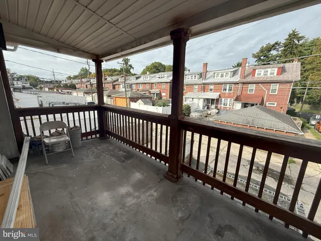 a view of a car park in front of house