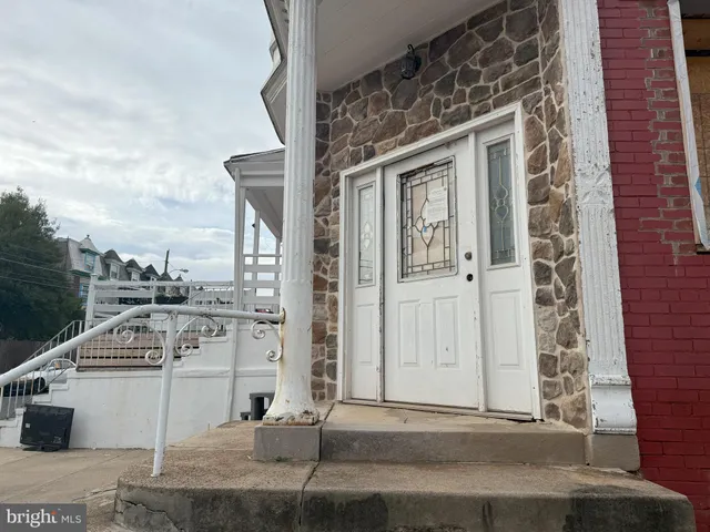 a backyard of a house with multiple trees