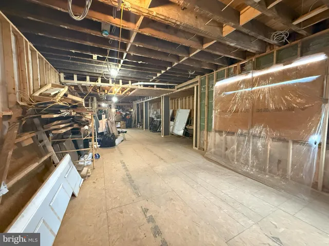 a view of a room with wooden walls