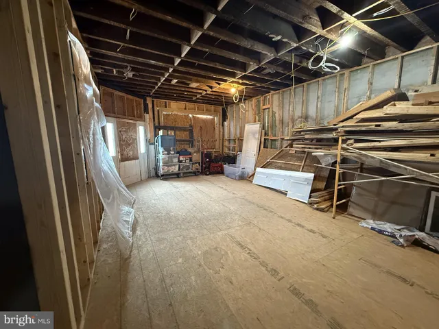 a view of staircase with white walls and windows