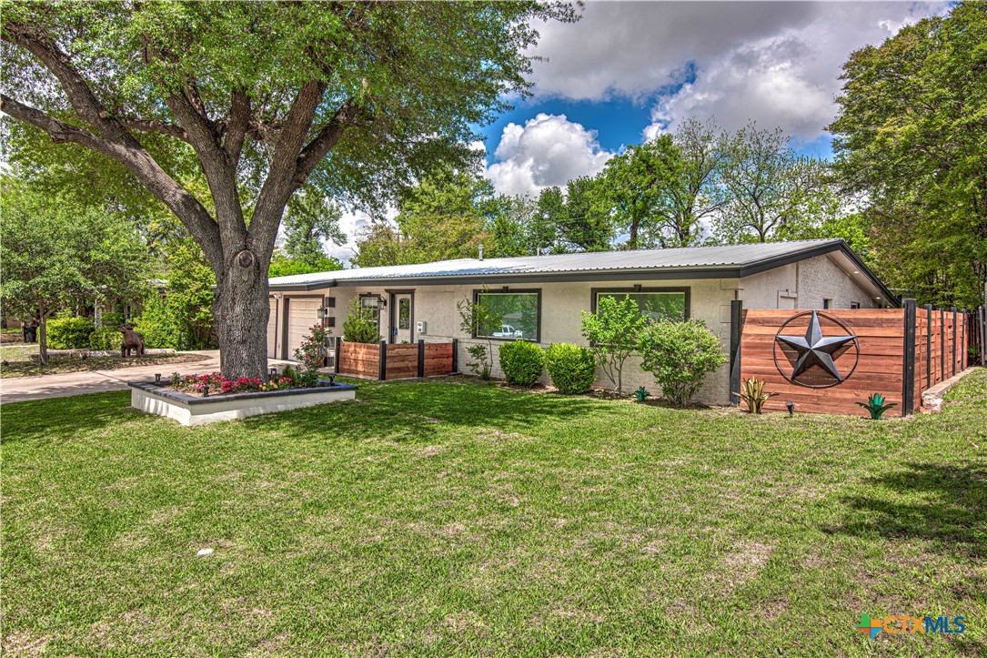 10 West Zenith Avenue Temple, TX 76501 - Photo 2 of 48 a view of a house with a yard and a tree