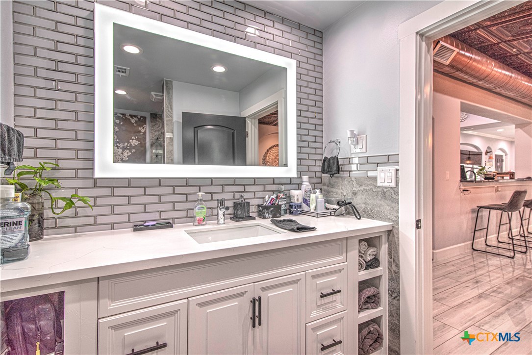 10 West Zenith Avenue Temple, TX 76501 - Photo 28 of 48 a bathroom with a sink and a mirror