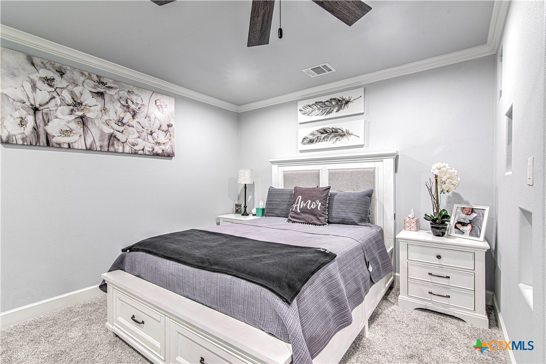 10 West Zenith Avenue Temple, TX 76501 - Photo 30 of 48 a bedroom with a bed and a painting on the wall
