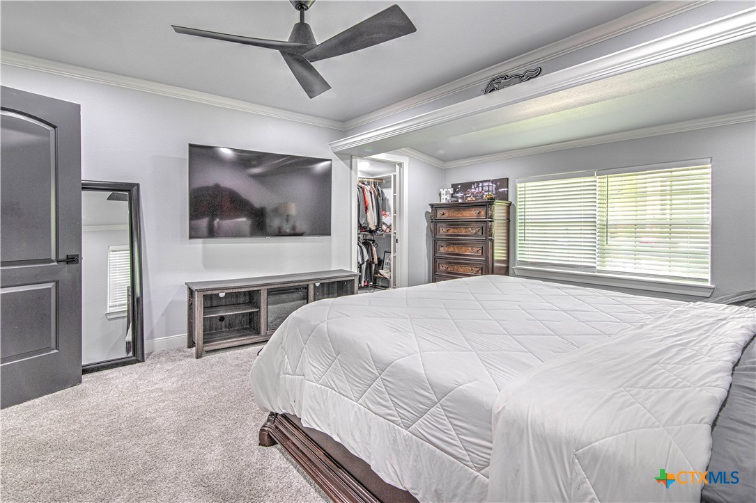 10 West Zenith Avenue Temple, TX 76501 - Photo 37 of 48 a bedroom with a bed and a flat screen tv