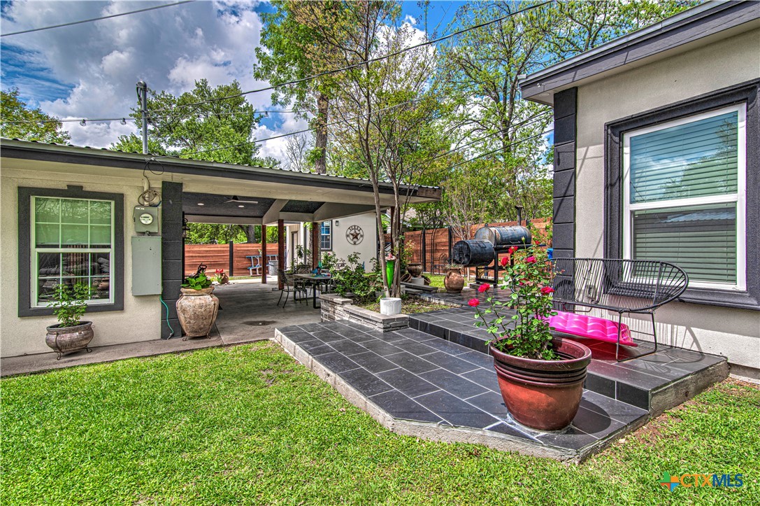 10 West Zenith Avenue Temple, TX 76501 - Photo 43 of 48 a view of a backyard with sitting area and garden