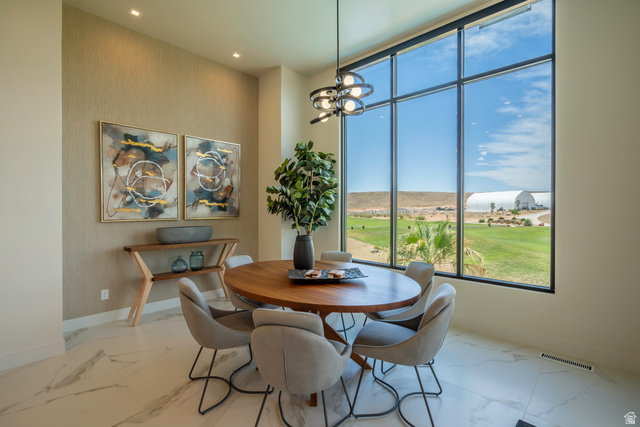 3606 South Cypress Road Hurricane, UT 84737 - Photo 16 of 69 Dining space with suspended lighting and light marble finish floors