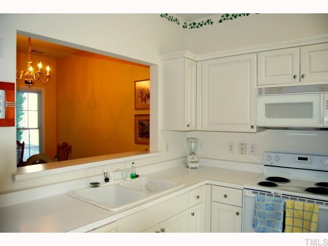 8320 Hempshire Place, Unit 101 Raleigh, NC 27613 - Photo 5 of 12 a bathroom with a sink and a mirror