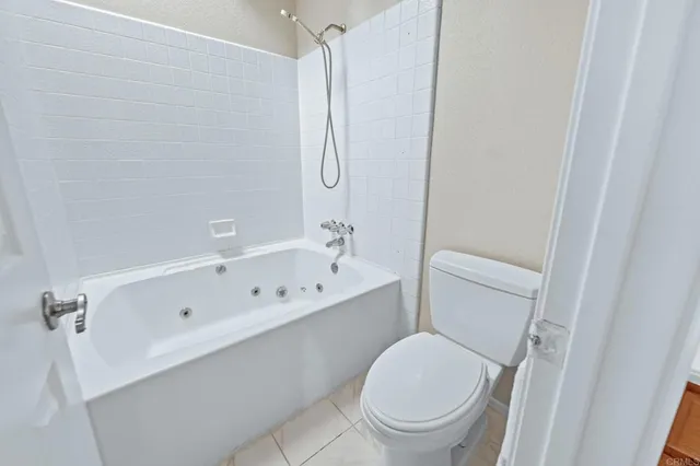 a bathroom with a toilet a sink and a bathtub
