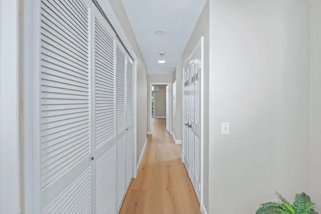 a view of a hallway with a white door