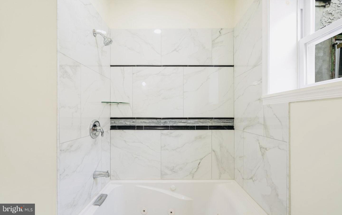 4847 Fairmount Avenue Philadelphia, PA 19139 - Photo 16 of 35 a bathroom with a shower and a bath tub