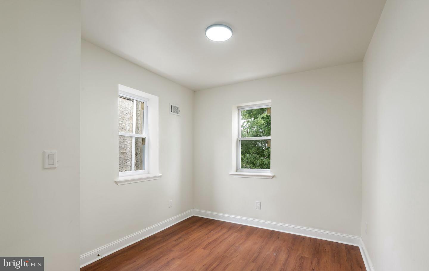 4847 Fairmount Avenue Philadelphia, PA 19139 - Photo 17 of 35 an empty room with wooden floor and windows