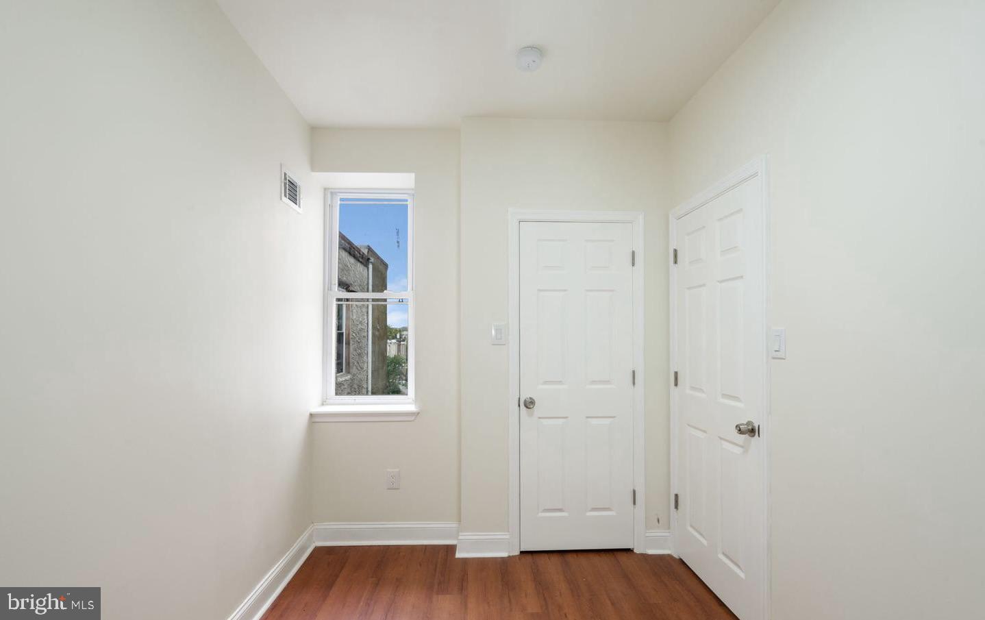 4847 Fairmount Avenue Philadelphia, PA 19139 - Photo 19 of 35 a view of an empty room with wooden floor and a window