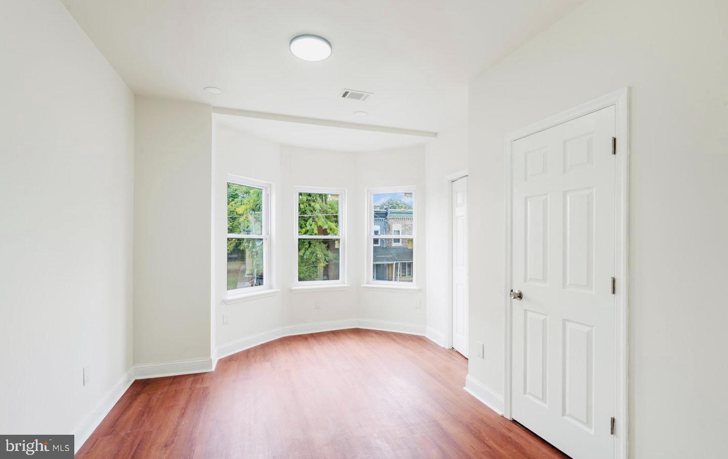 4847 Fairmount Avenue Philadelphia, PA 19139 - Photo 22 of 35 an empty room with wooden floor and windows
