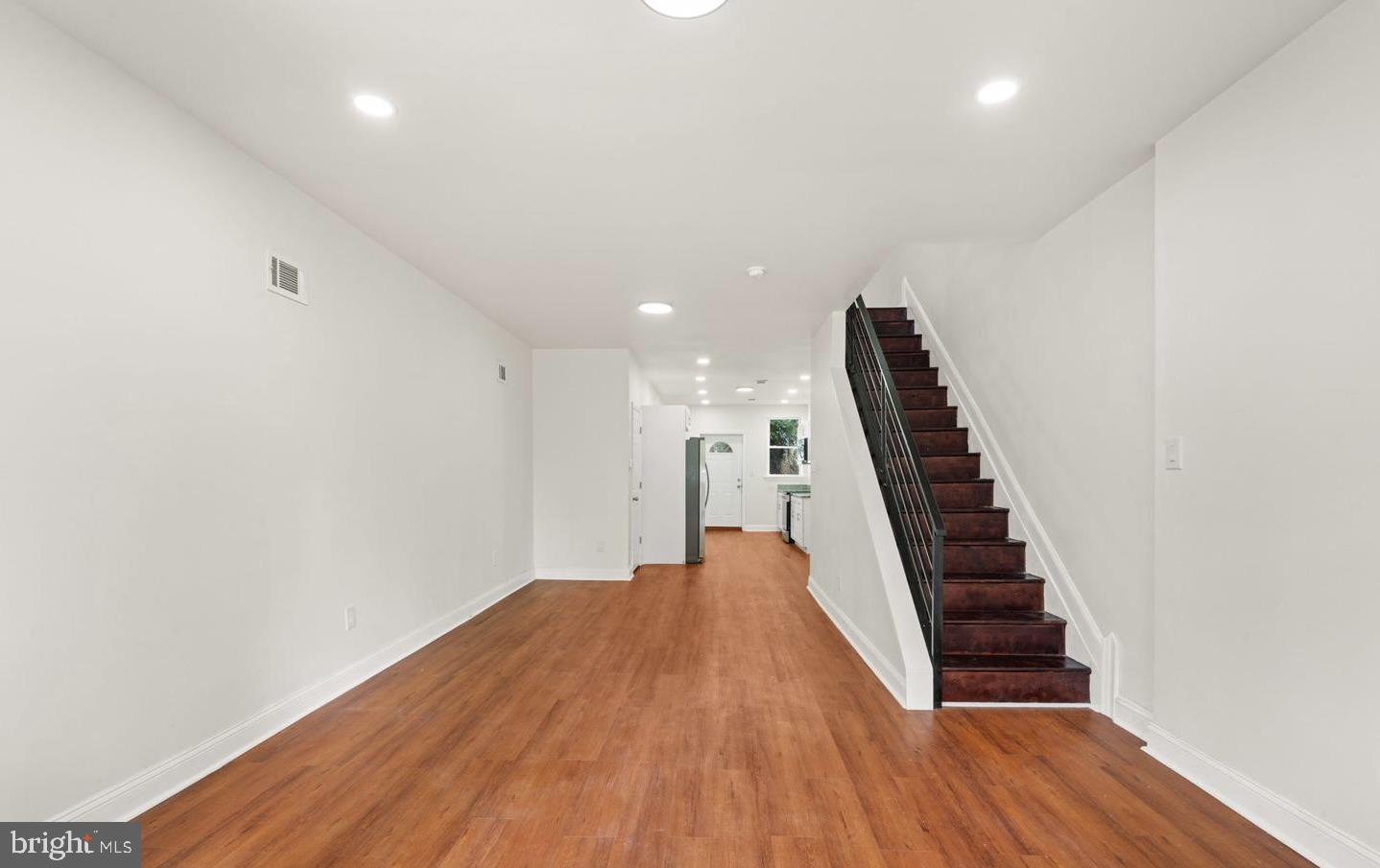 4847 Fairmount Avenue Philadelphia, PA 19139 - Photo 4 of 35 a view of a hallway with wooden floor and staircase