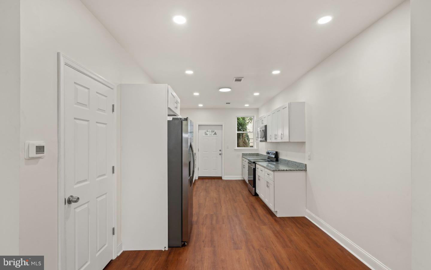 4847 Fairmount Avenue Philadelphia, PA 19139 - Photo 8 of 35 a kitchen with stainless steel appliances granite countertop a refrigerator and a stove top oven
