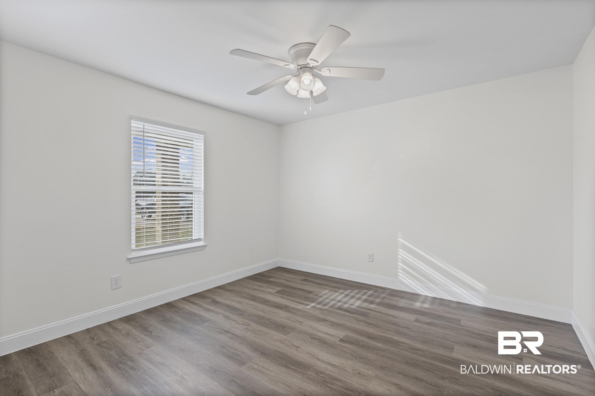 3041 Pretty Branch Drive East Mobile, AL 36618 - Photo 15 of 20 Unfurnished room featuring wood finished floors and a ceiling fan