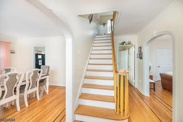 a view of a living room and wooden floor