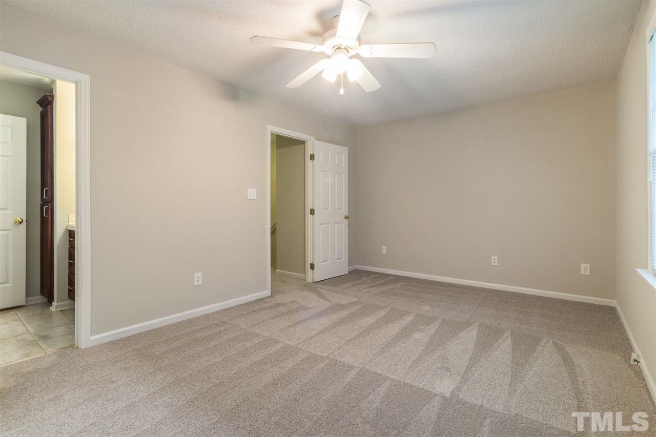 4451 Antique Lane Raleigh, NC 27616 - Photo 17 of 24 an empty room with fan and a ceiling fan