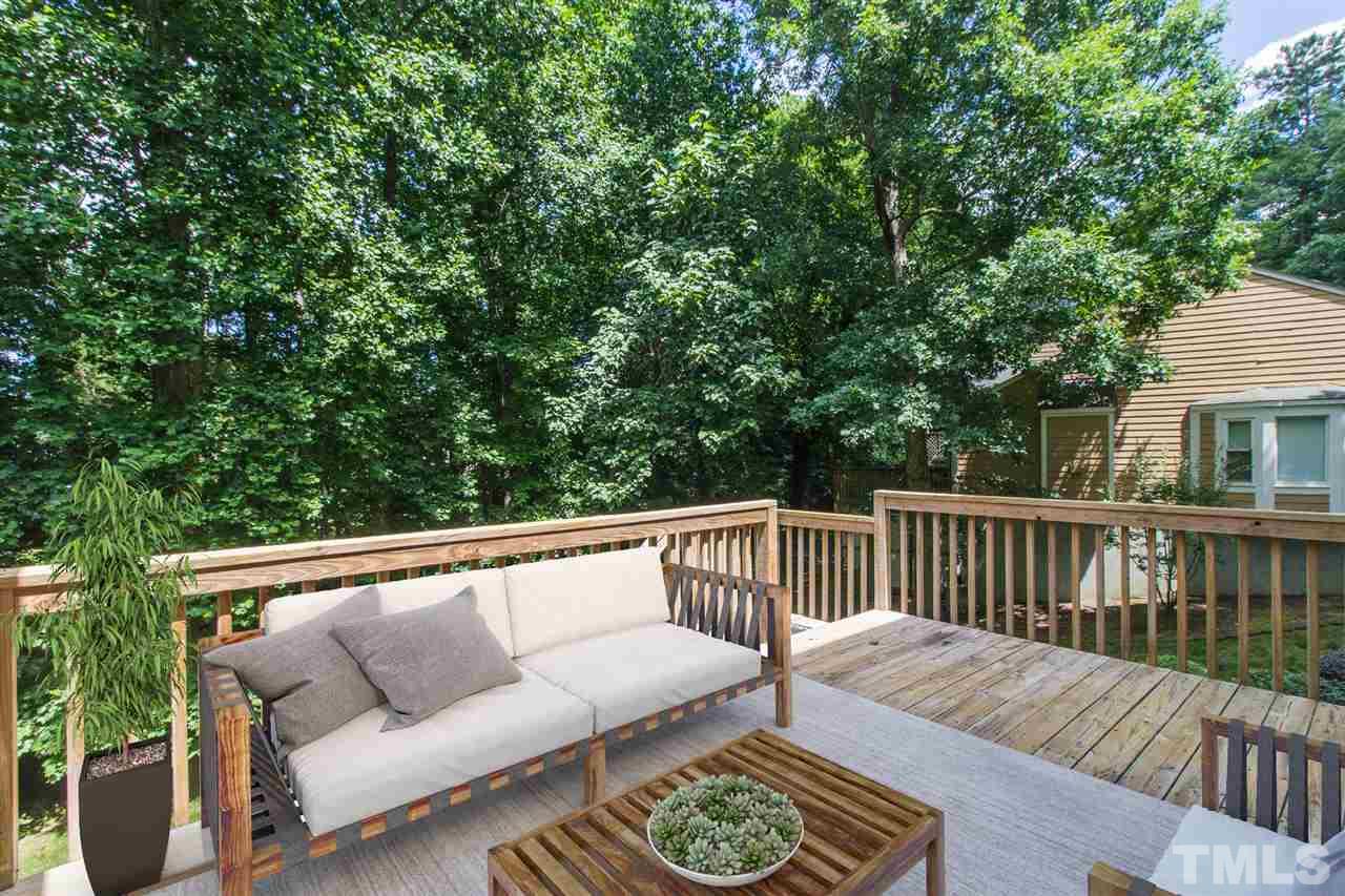 4451 Antique Lane Raleigh, NC 27616 - Photo 18 of 24 a balcony with wooden floor and outdoor seating