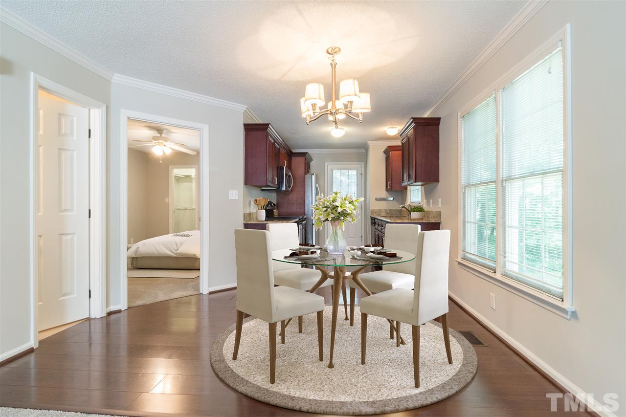 4451 Antique Lane Raleigh, NC 27616 - Photo 3 of 24 a view of a dining room with furniture window and wooden floor